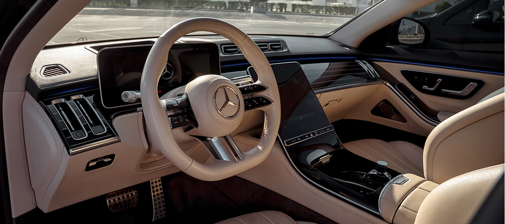 Luxury chauffeur service vehicle interior with premium leather seats and modern car features